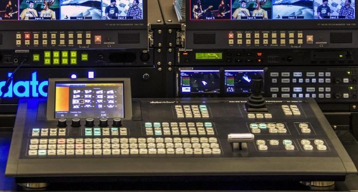 Driving Business Success with Targeted Video Production Campaigns Video production control room with switcher and live feed monitors
