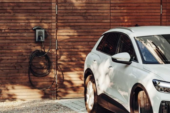 Electric vehicle at charging station showing performance technology