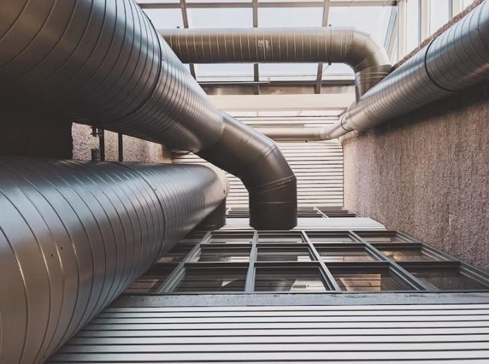 Modern HVAC ductwork in a sustainable commercial building.
