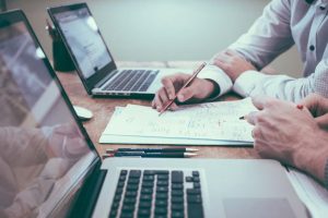 Business team planning outsourcing IT support strategy